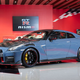 A Nissan GT-R with blue bodywork and exposed carbon fibre details